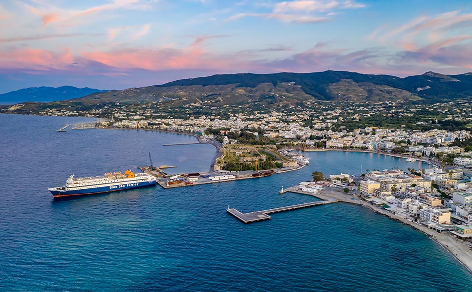 Aerial panoramic view of Kos port with Blue Star Ferry moored.